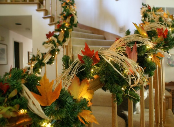 stair bannister decorated for thanksgiving and christmas