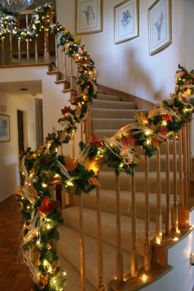 stair bannister decorated for thanksgiving and christmas