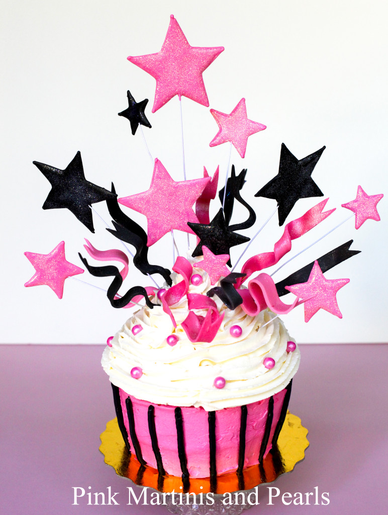 jumbo birthday cupcake with stars and fondant ribbons