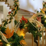 stair bannister decorated for thanksgiving and christmas